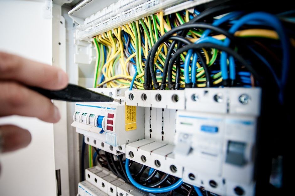 Close-up of colour-coded electrical wiring on a Hager distribution board